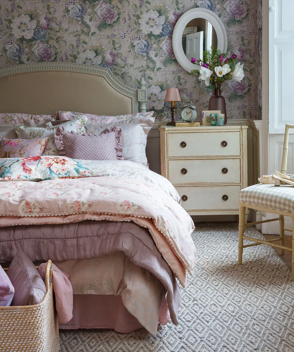 Floral Wallpaper and Soft Pink Bedding Create a Romantic Haven