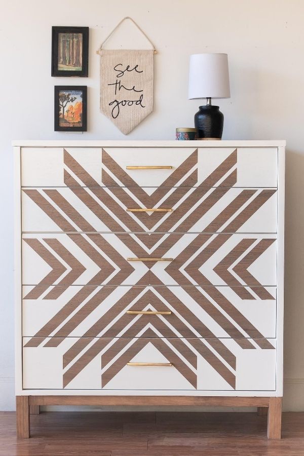 Boho furniture ideas: Patterned dresser, vibrant decor, plants, cozy ambiance.