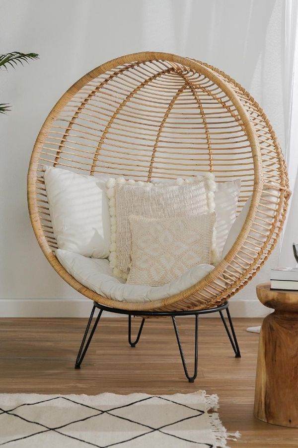 Boho space featuring rattan chair, showcasing boho furniture ideas inspiration.