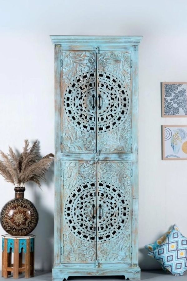 Boho Nook with turquoise carved cabinet, vibrant and eclectic, boho furniture ideas.