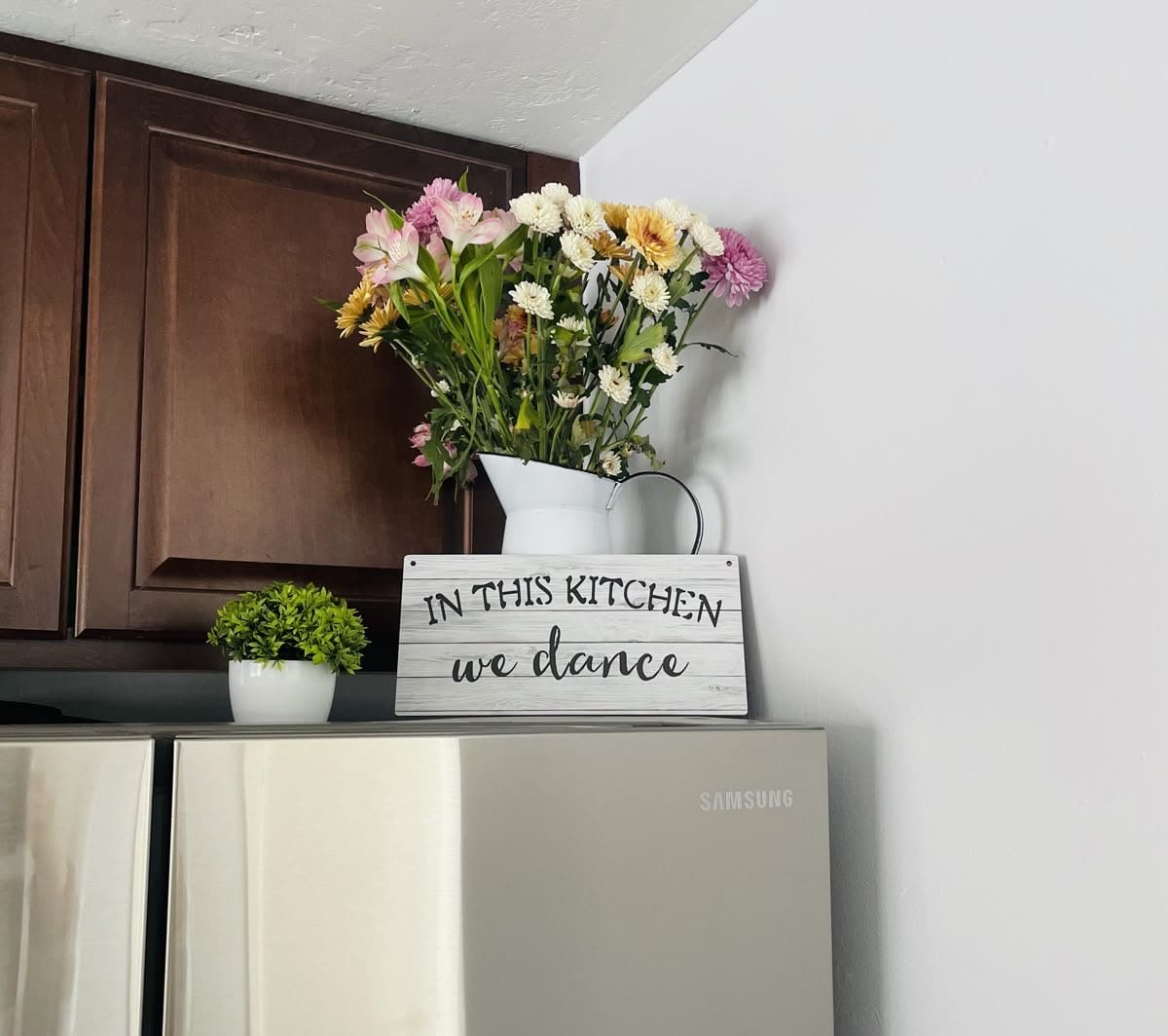 Brighten Your Space with a White Enamel Pitcher and Flowers