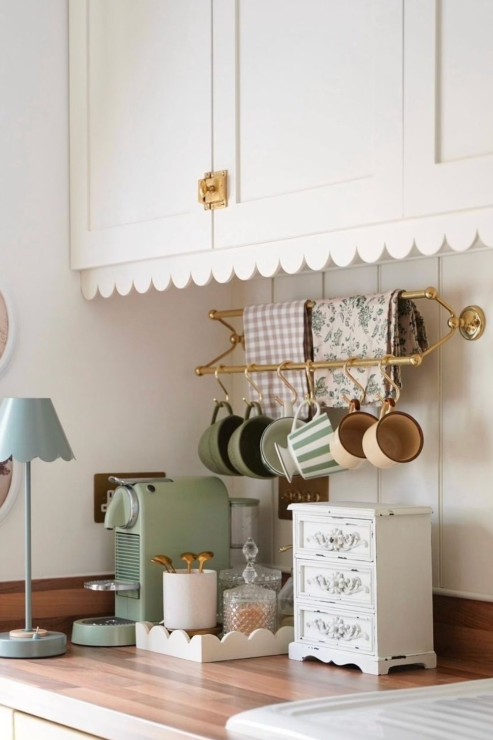 Decorative Valance Frames a Brass Mug Rail