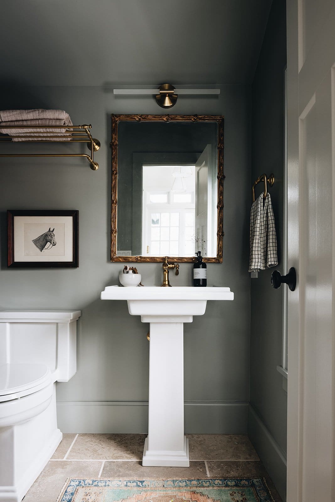 Frame Your Sink with an Ornate Gold Mirror