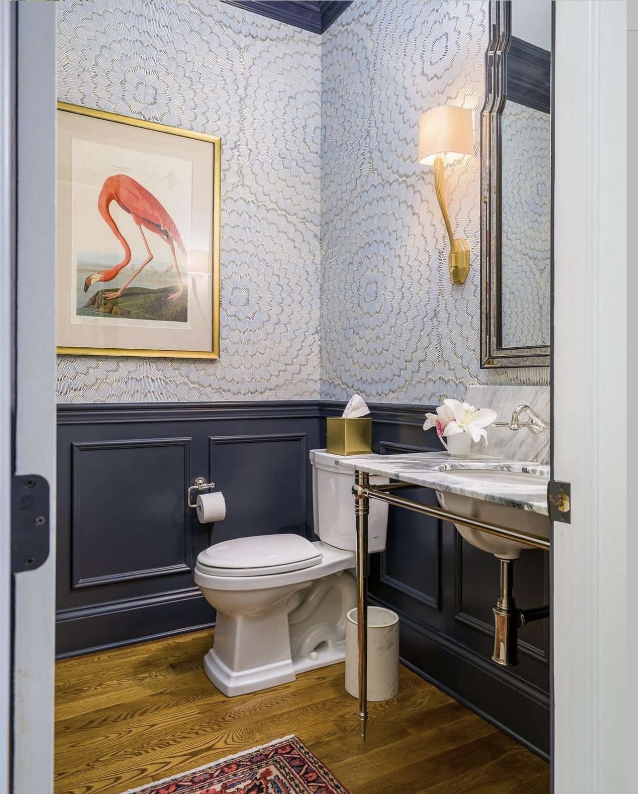Gold-Framed Flamingo Art Adds A Pop Of Color Above Paneling