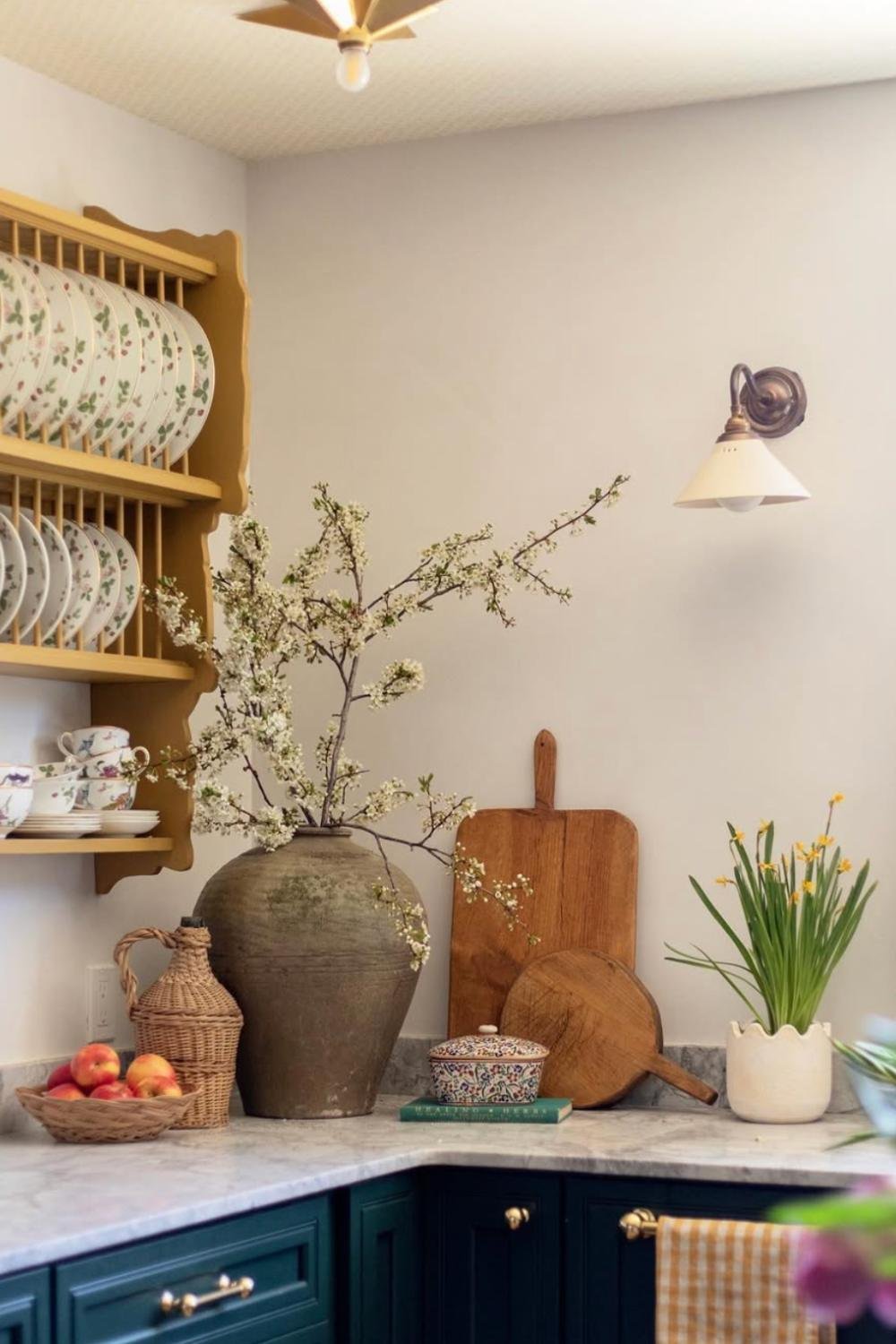 Large Terracotta Vase Holds Blooming Branches For Spring