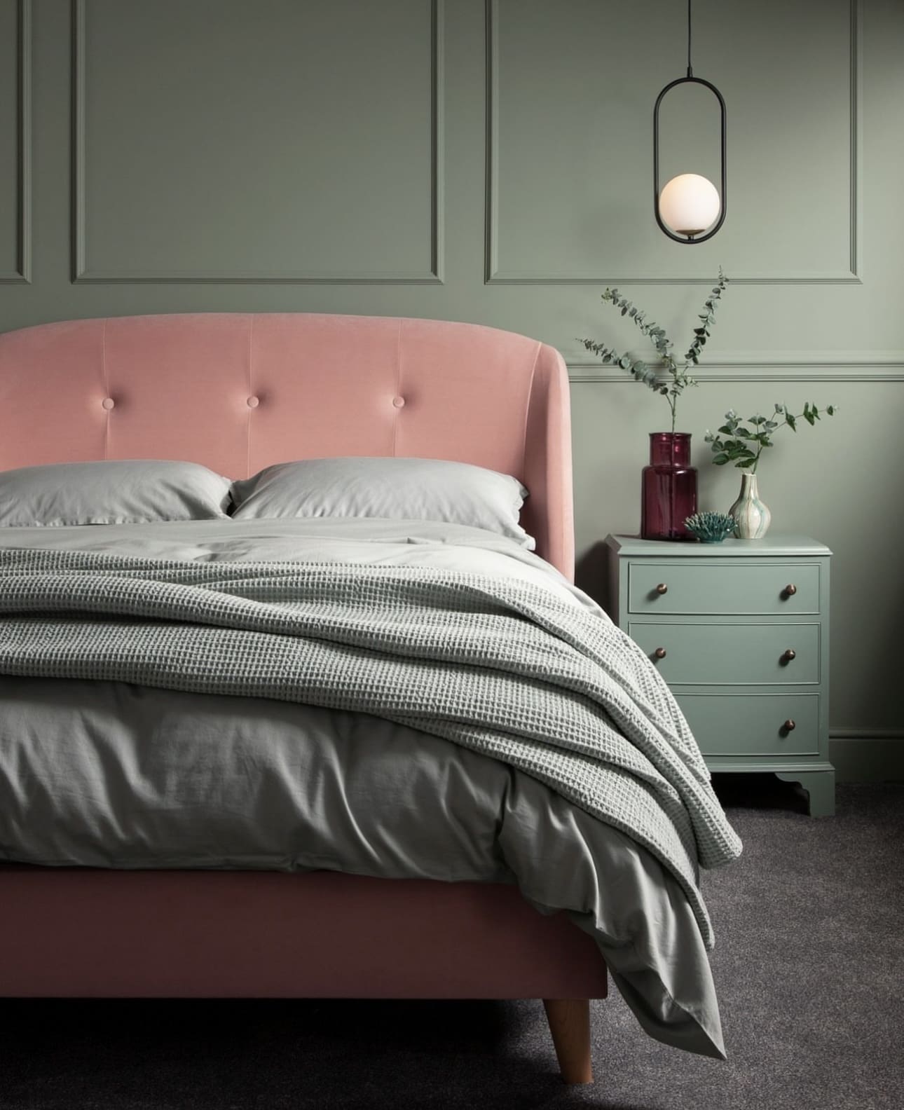 Contrast Sage Walls with a Pink Velvet Headboard