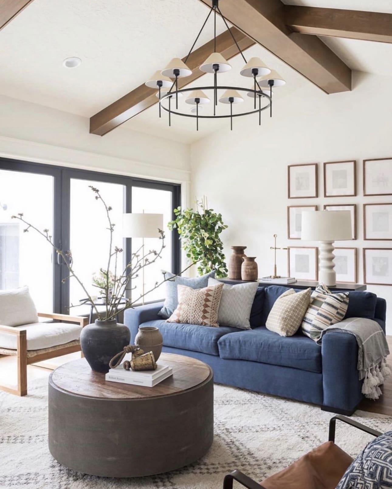 Gallery wall of framed art adds symmetry to the wall