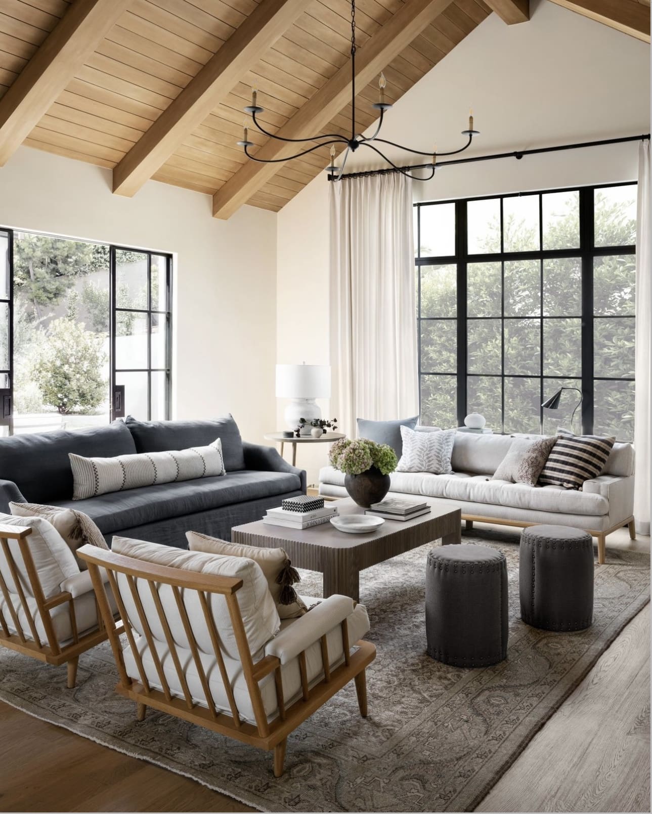 Layer Seating with Wood-Slat Chairs and a Textured Rug