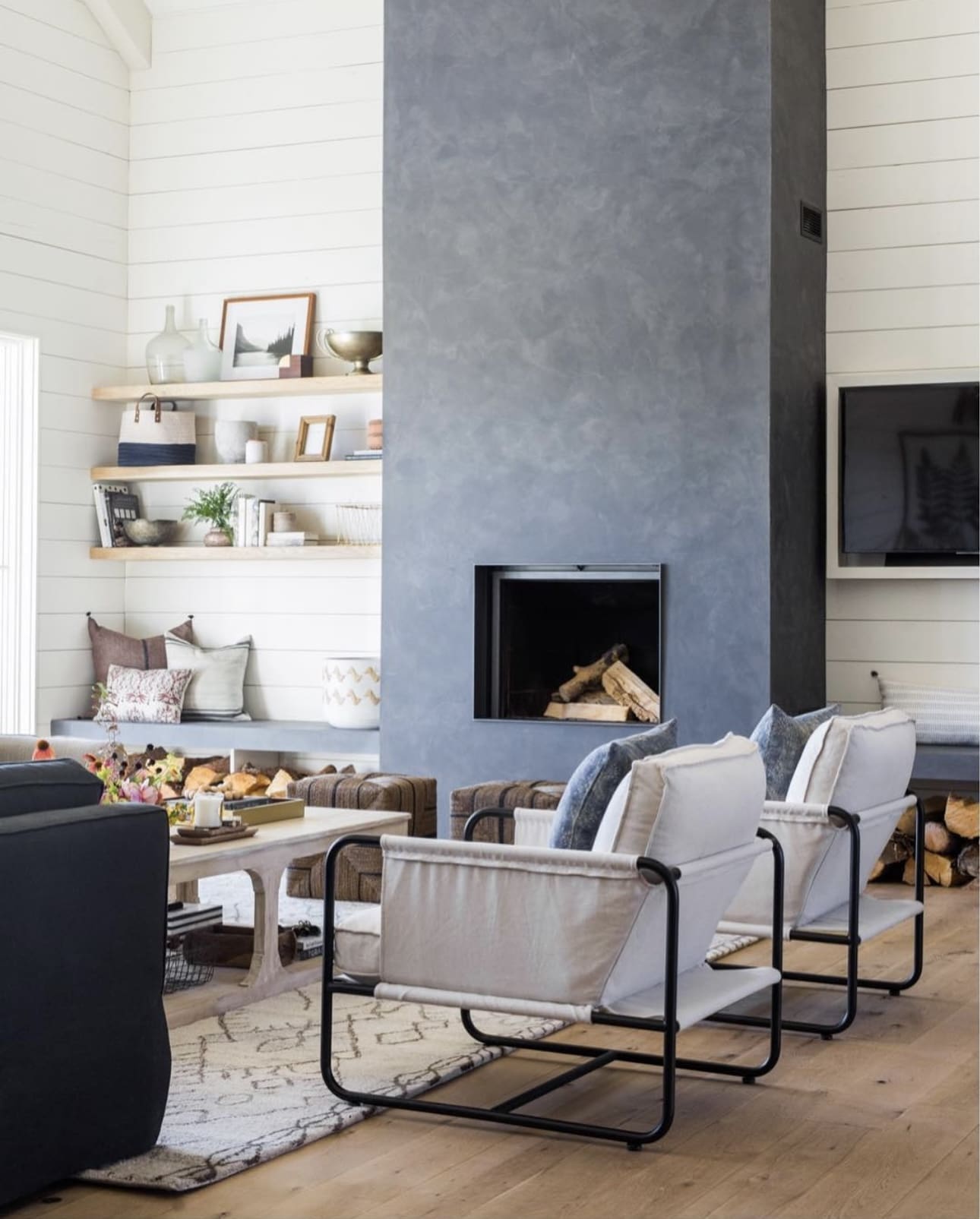 Floating shelves display curated decor and practical baskets