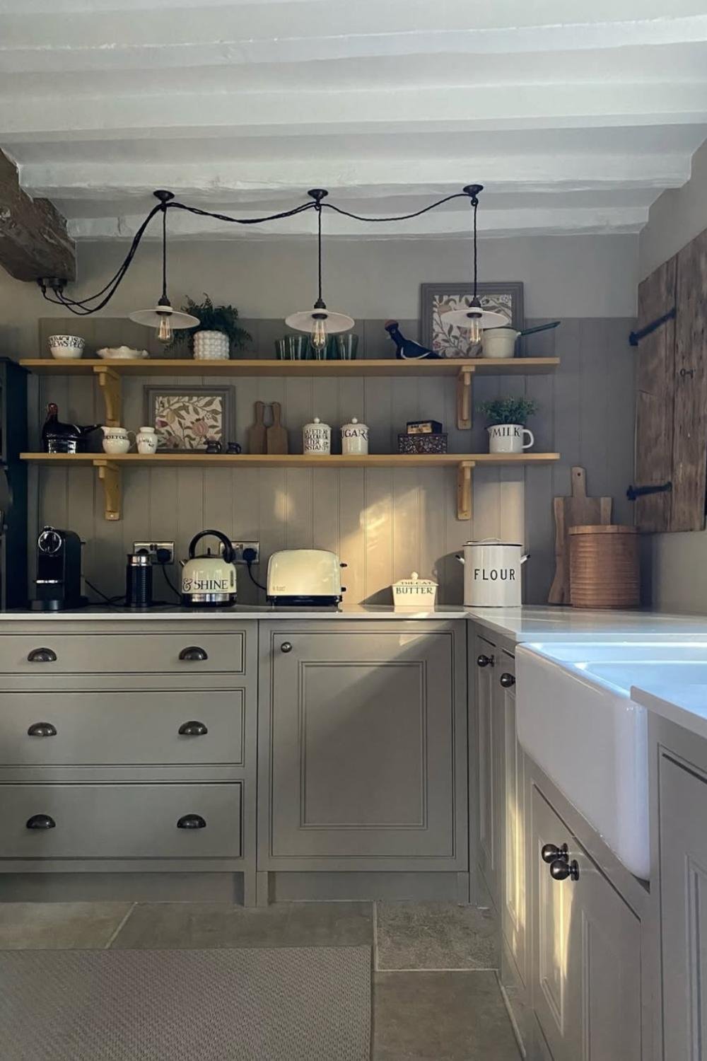 Open Shelving Displays Vintage Jars and Artwork