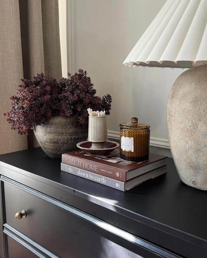 Dark matte black Ikea Koppang dresser with earthy decor including ceramic lamp and amber candle from @house.on.oak.lane. Stylish ikea koppang hacks.
