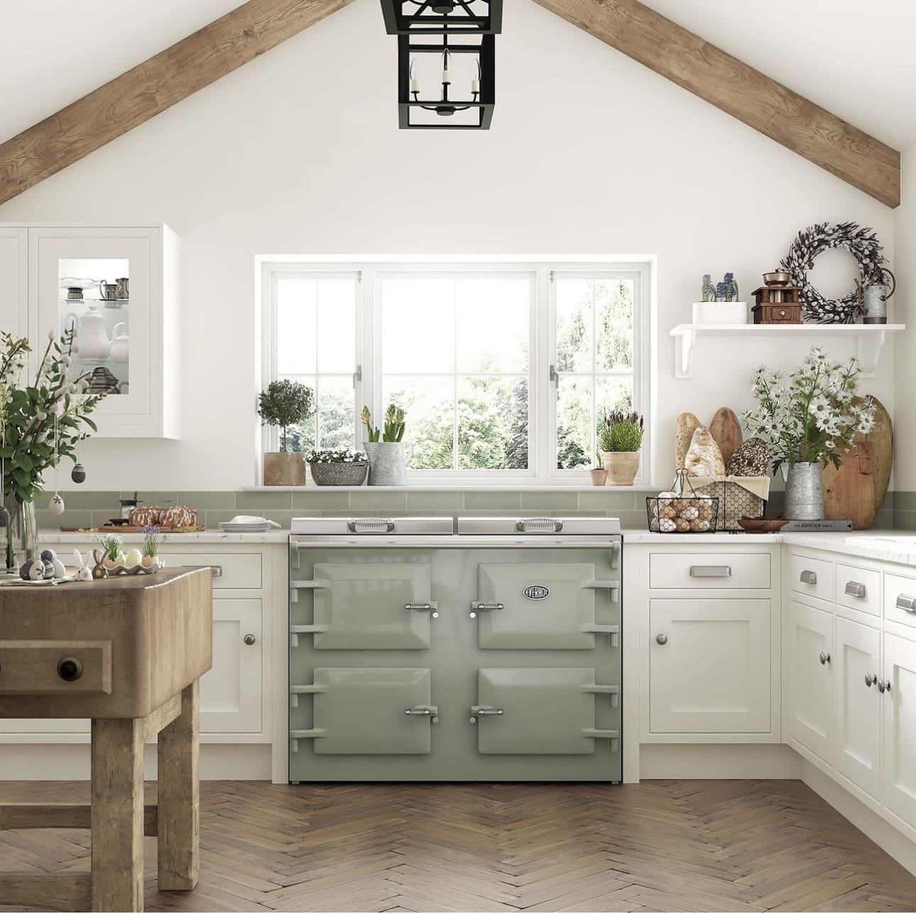 Sage green range anchors the kitchen with its classic Aga style