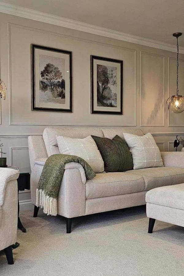 Living room panelling with serene neutrals creates a timeless charm.
