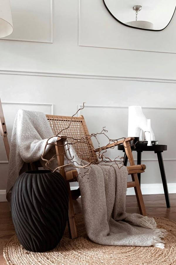 Cozy elegance with woven accents complements sophisticated living room design.