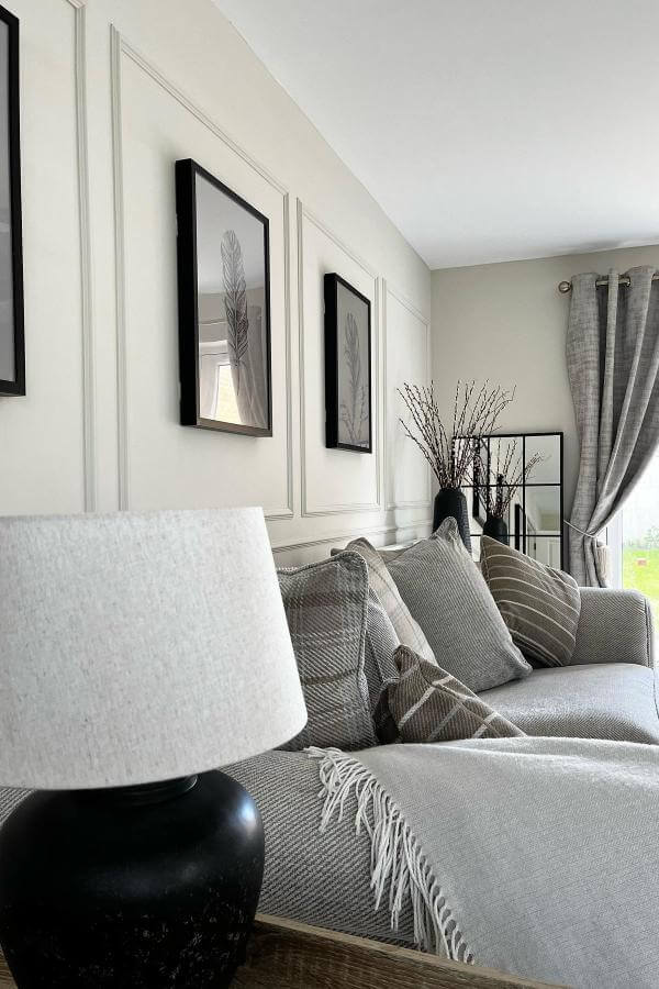 Warm neutrals and sleek furnishings create a cozy, contemporary living space.