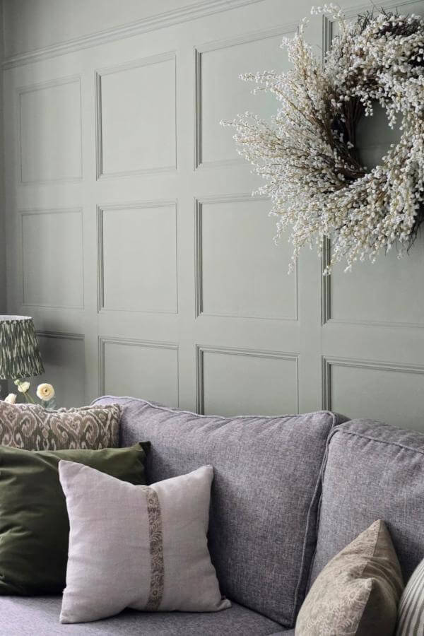 Muted sage panels bring cozy sophistication to the living room.