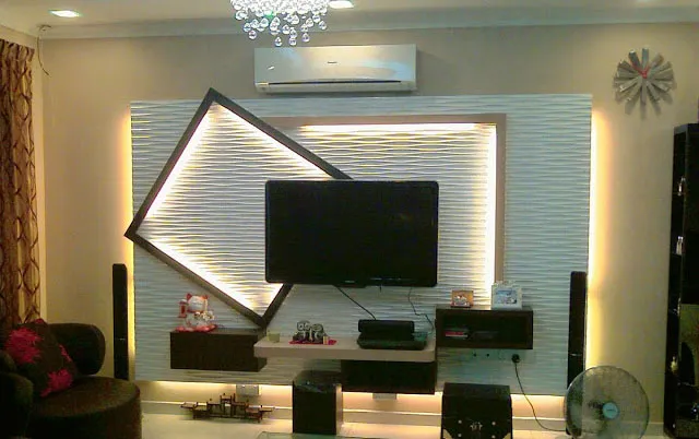 Angled Frame Highlights Textured TV Wall With Dynamic Lighting