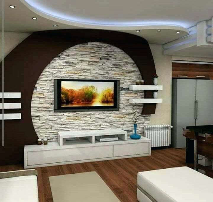 Textured Stone Accent Wall Frames TV With Open Shelving