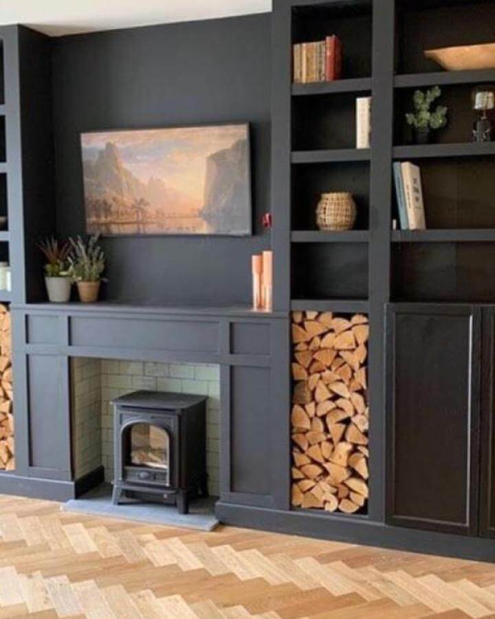 charcoal painted media center with stacked wood storage and shelves from @fixupjaynesharp cozy rustic vibe ikea media center hacks & ideas