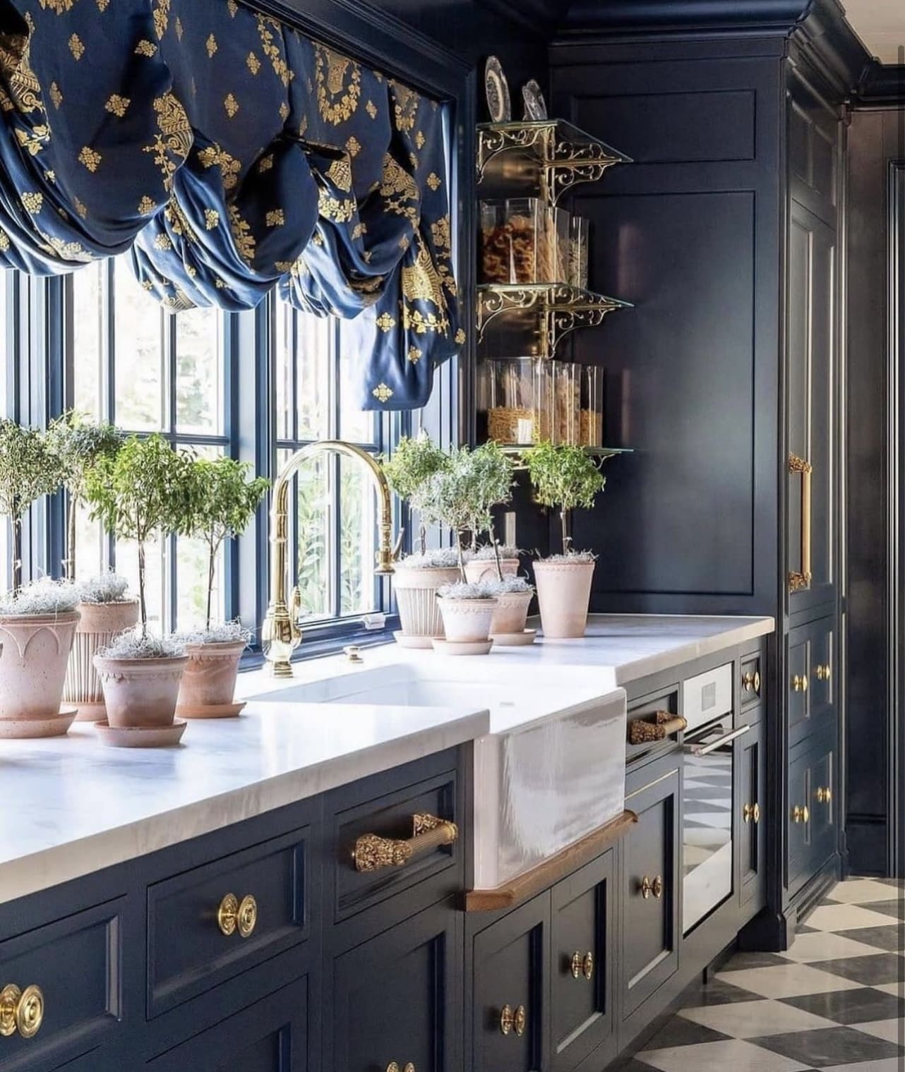 Natural Accents: Terracotta Pots on Blue Kitchen Countertops