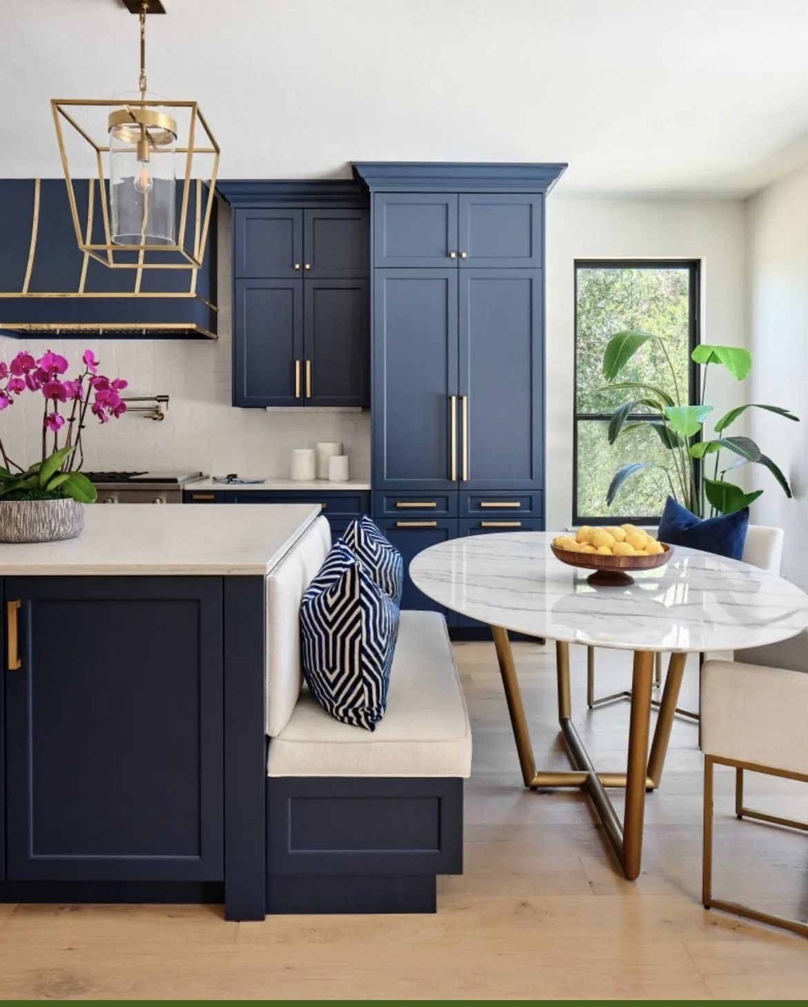 Cozy Nook: Built-in Banquette with Blue Cabinetry