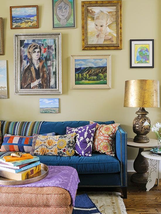 Gallery Wall With Varied Frames Adds Personality Above Blue Sofa