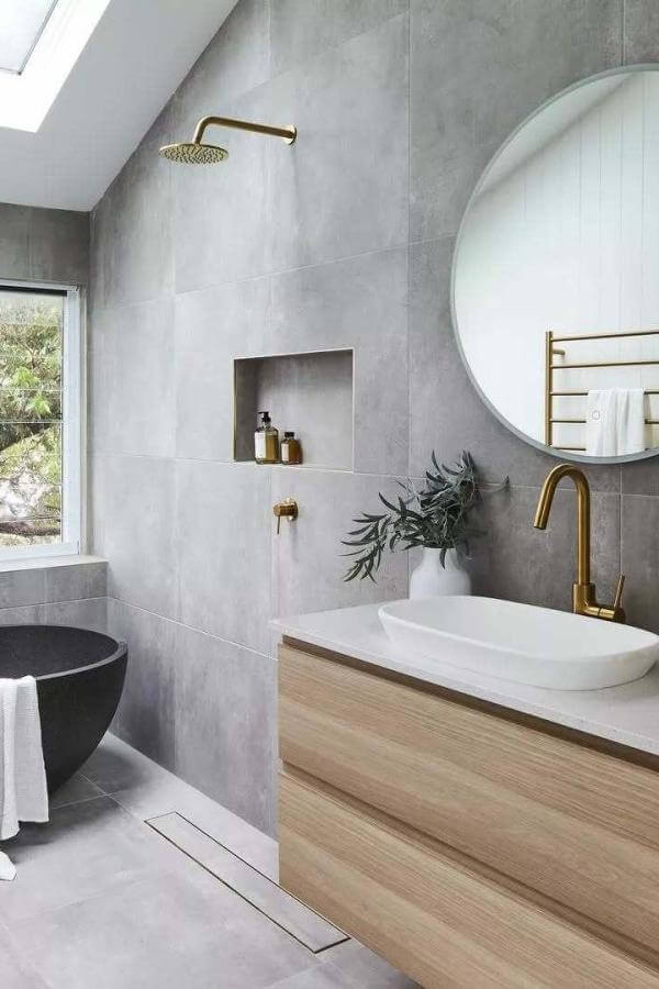 Golden accents elevate the bathroom decor from @austpekbathrooms, adding luxurious charm to the overall design.